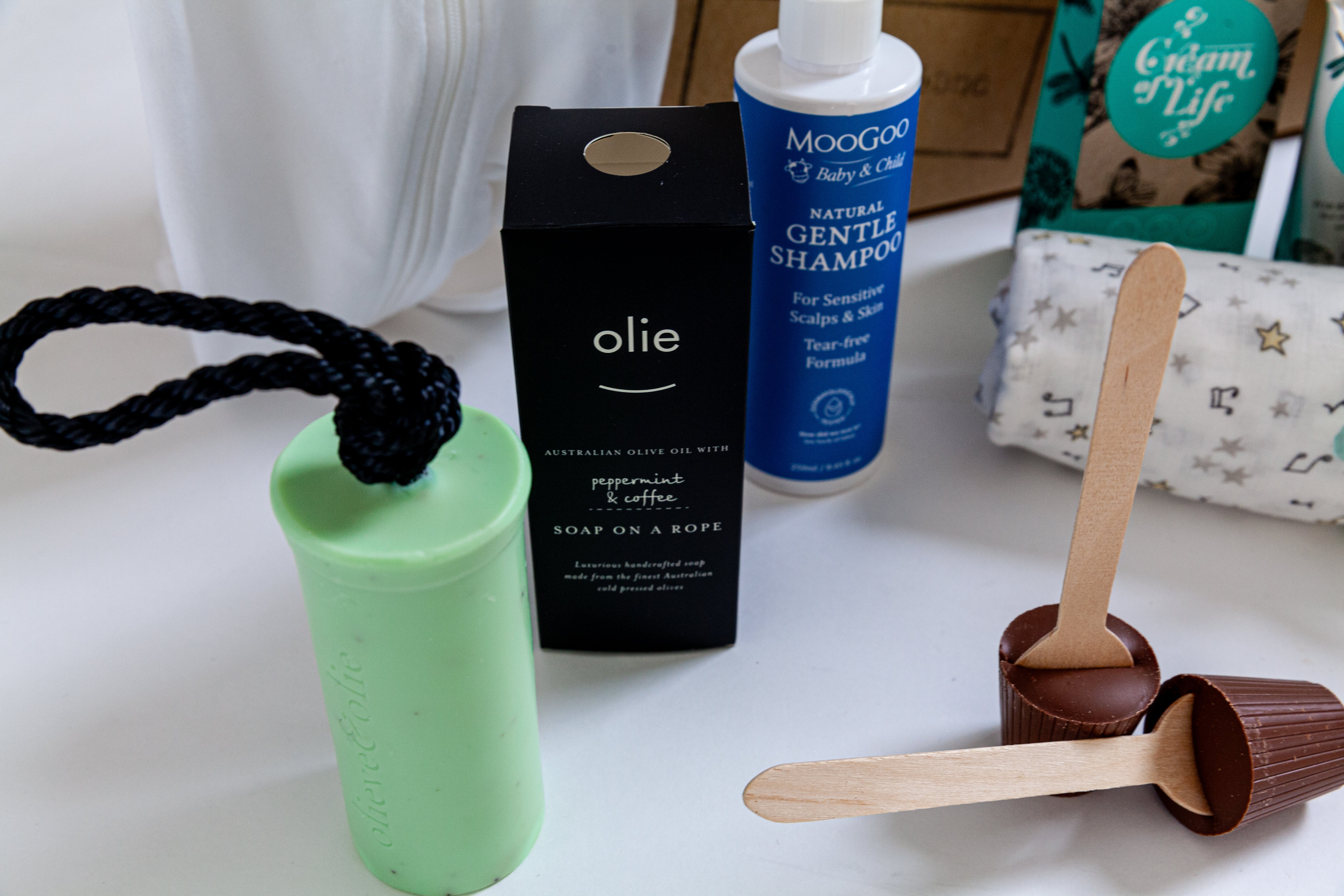 Olieve & Olie peppermint and coffee soap on a rope, moogoo, and chocolate spoons. Baby boy hamper Australia, corporate maternity gifts Australia