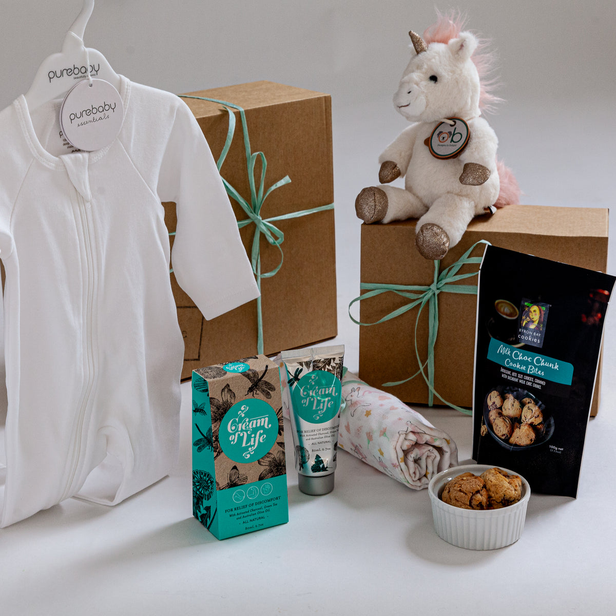 Unicorn Wishes baby gift box with Little Misty Unicorn toy and Australian baby essentials. New baby gifts, corporate maternity leave gifts. Baby girl hamper